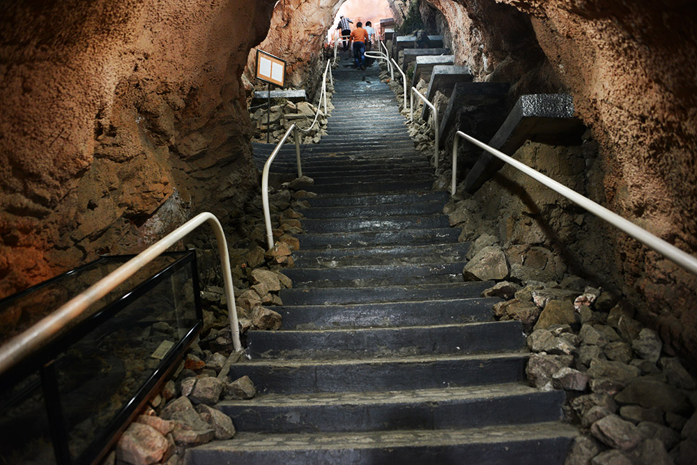 Staircase Inside the Cave Museum Long staircase ascending through the Sulaiman-Too Cave Museum