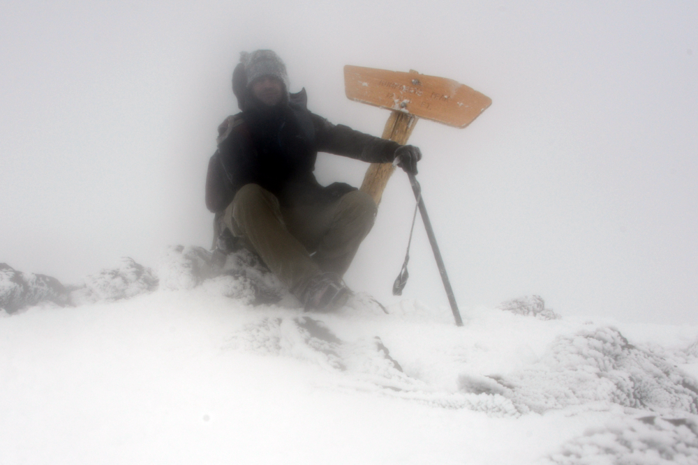George Kashouh standing on the summit of Humphreys Peak during a winter climb
