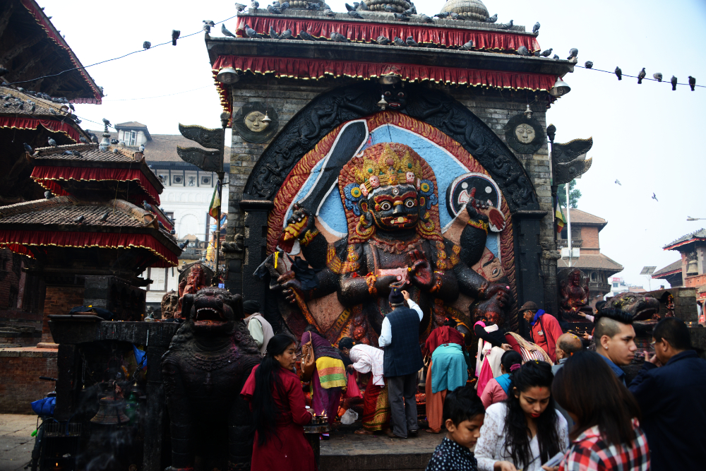 Large stone image of the Hindu deity Kal Bhairav in Kathmandu Durbar Square