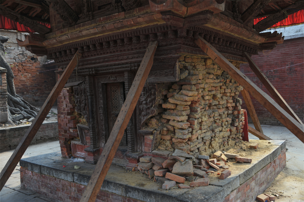 Wooden supports stabilizing an earthquake-damaged temple in Kathmandu Durbar Square