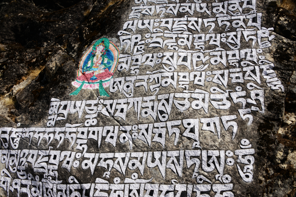 Buddhist inscriptions on mani stones beside the Khumbu Valley trekking trail