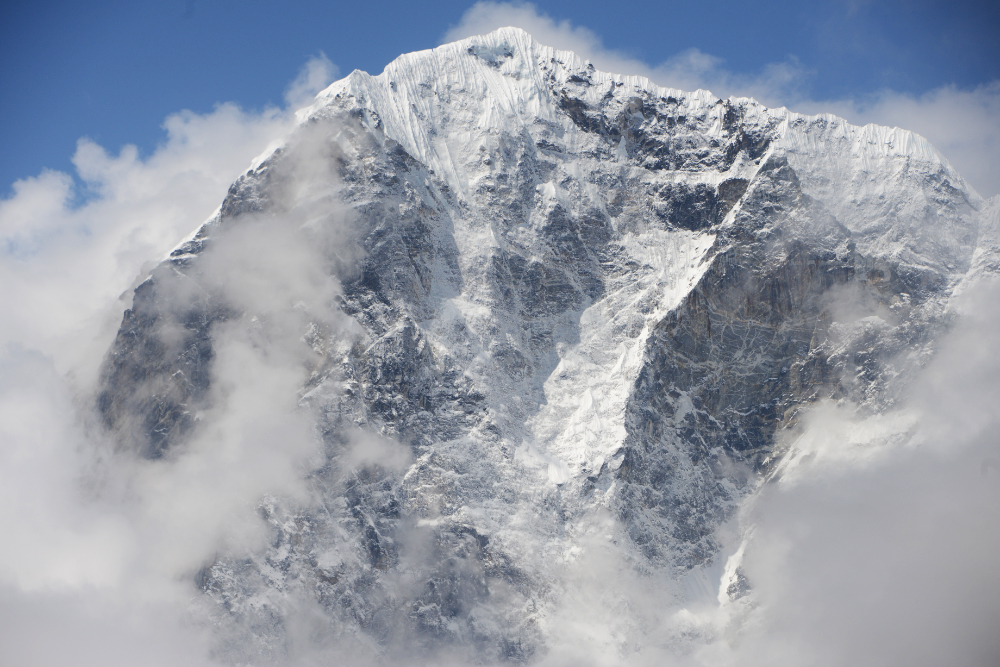 Steep snow-covered summit of Cholatse mountain in Nepal's Khumbu region