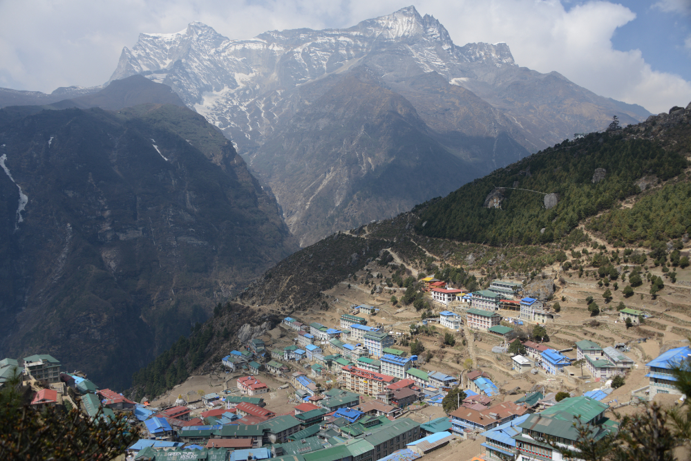 Hillside town of Namche Bazaar surrounded by Himalayan mountains