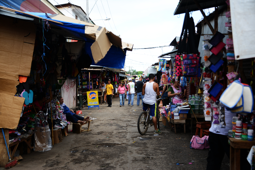 Vendors and shoppers inside Granada's traditional market