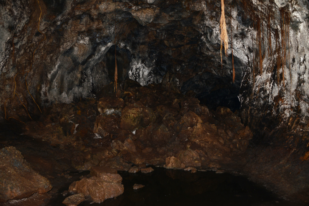 Volcanic rock formations and narrow passage inside a Masaya lava tube
