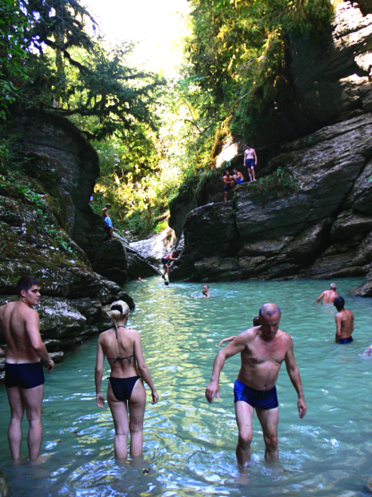 Swimming beneath rocky cliffs near Sochi Russia