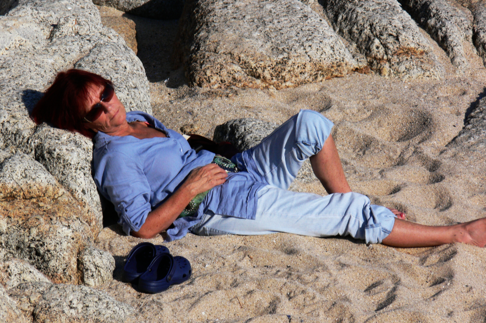 Cape Town Coast Woman relaxing beside the coast in Cape Town South Africa