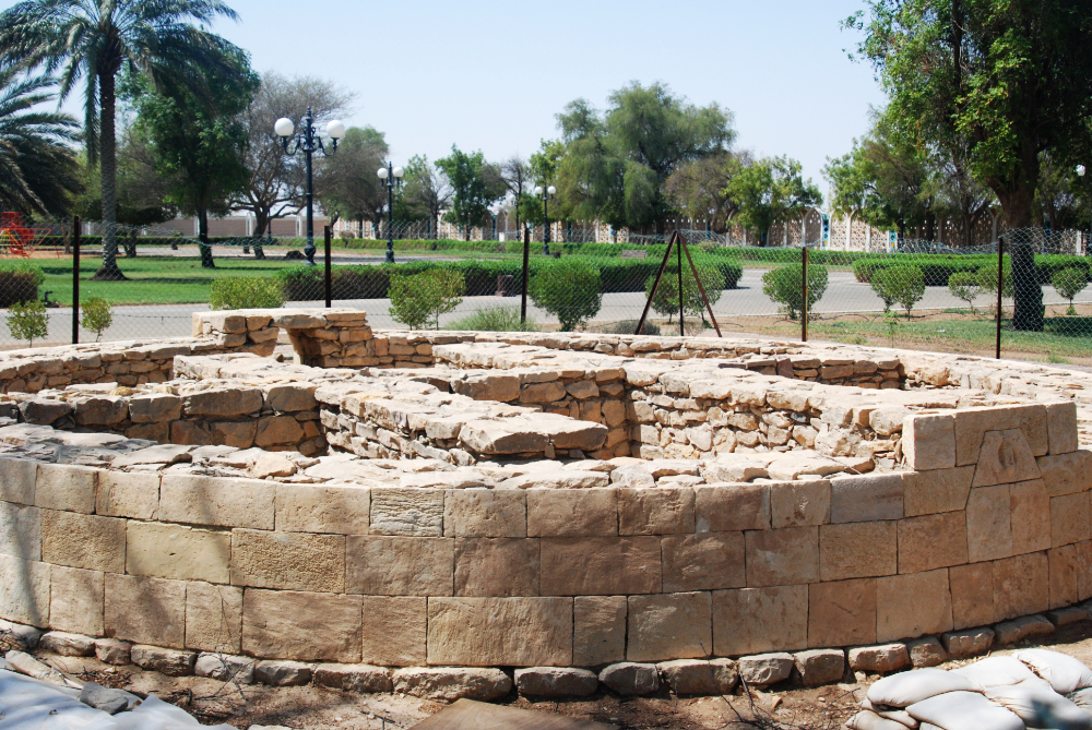 Ancient stone structure with carved animal figures at Hili Archaeological Park