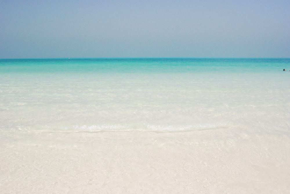 Beach and clear coastal water in Dubai, United Arab Emirates