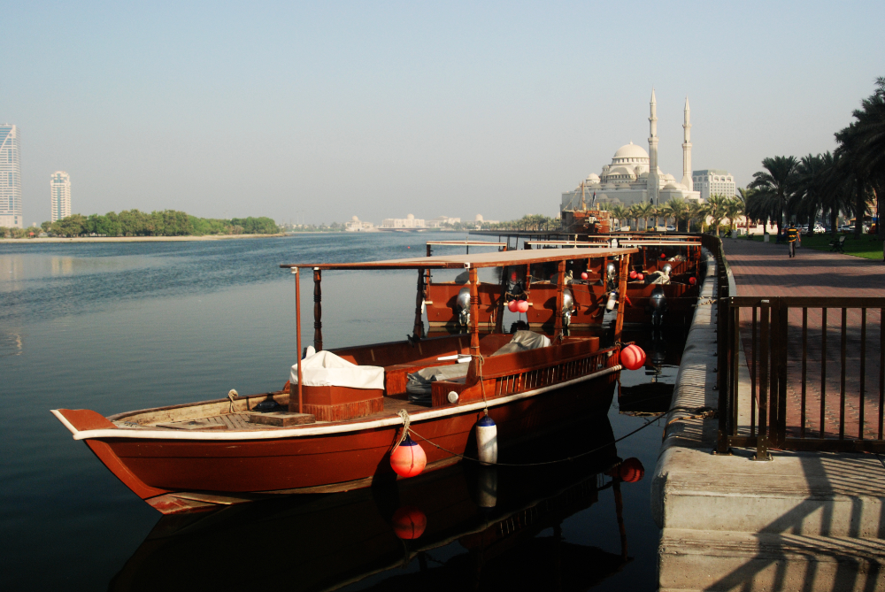 Boats moored along the waterfront in Sharjah